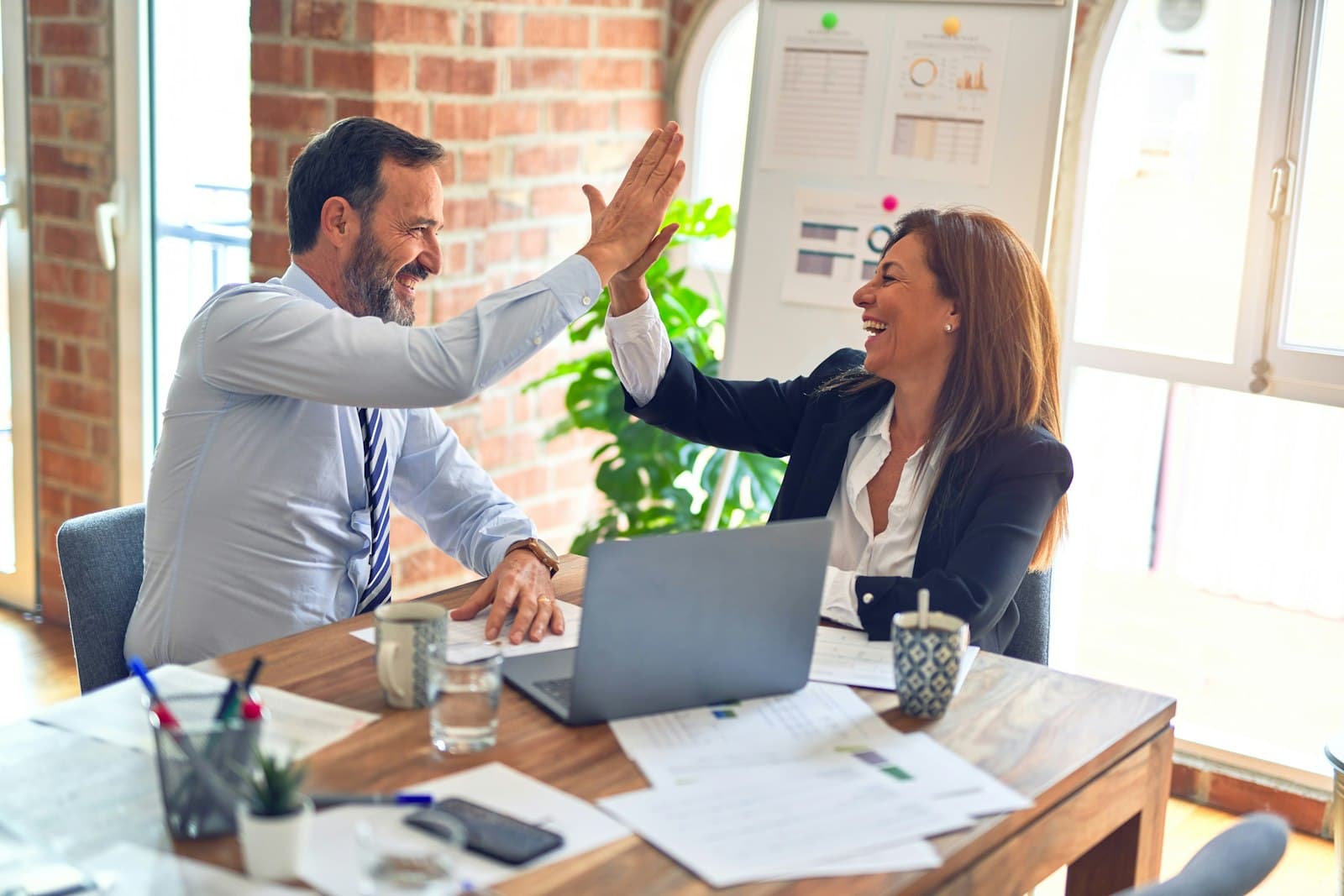 Business leaders in a meeting discussing digital product and AI strategy