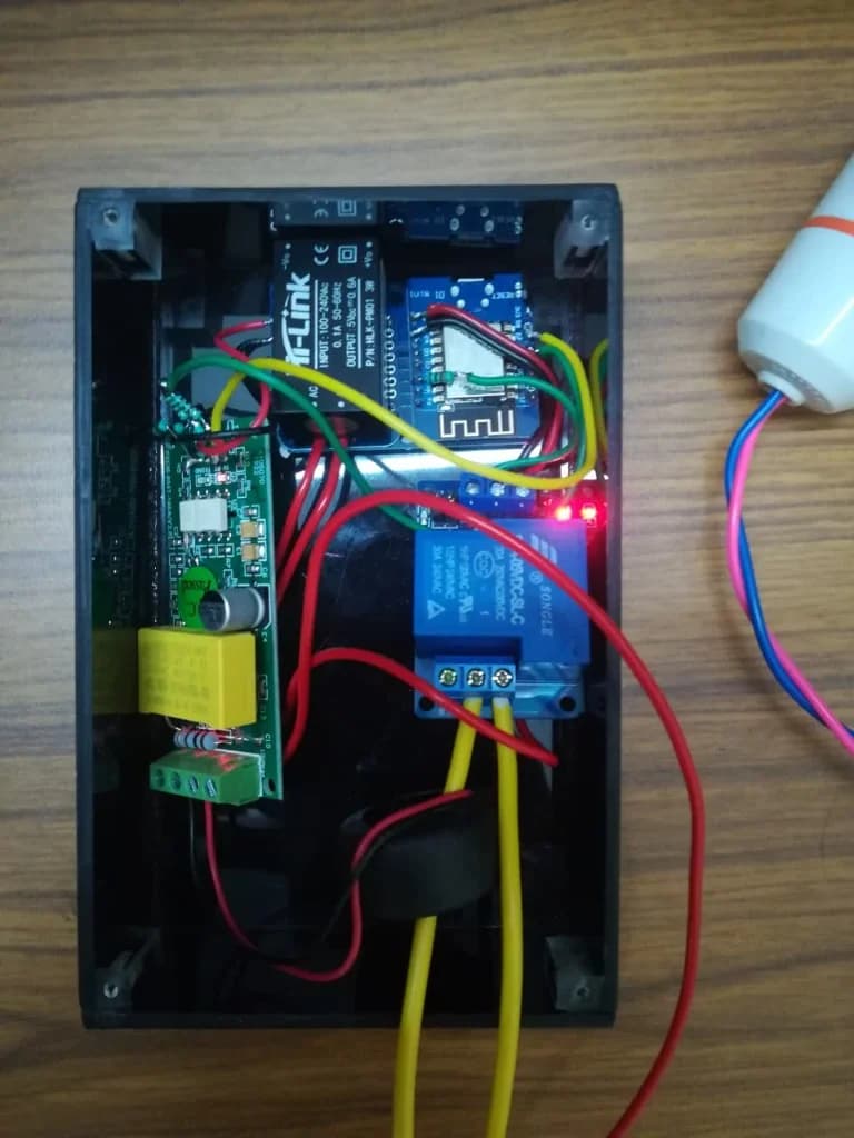 Production IoT enclosure showing PZEM-004T energy meter, ESP8266 controller, and L&T industrial contactor
